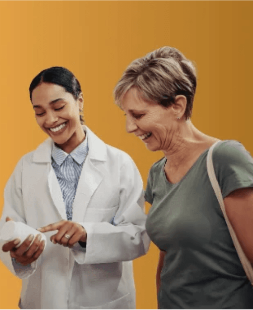 A pharmacist going through a medicine with a patient
